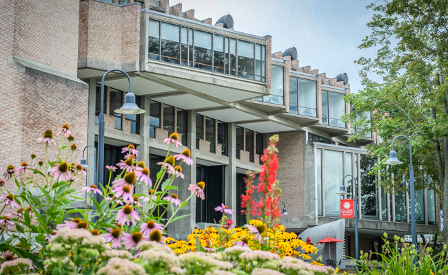 campus building with flowers