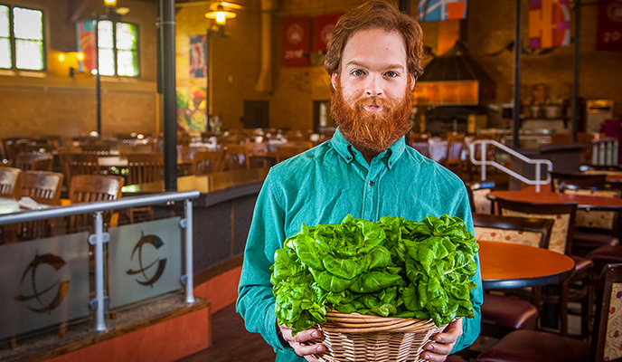 man holding lettuce