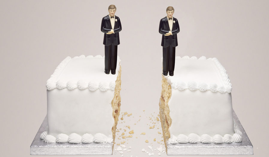 wedding cake with two male statues on