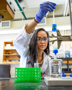 Diana Argiles Castillo using science lab equipment