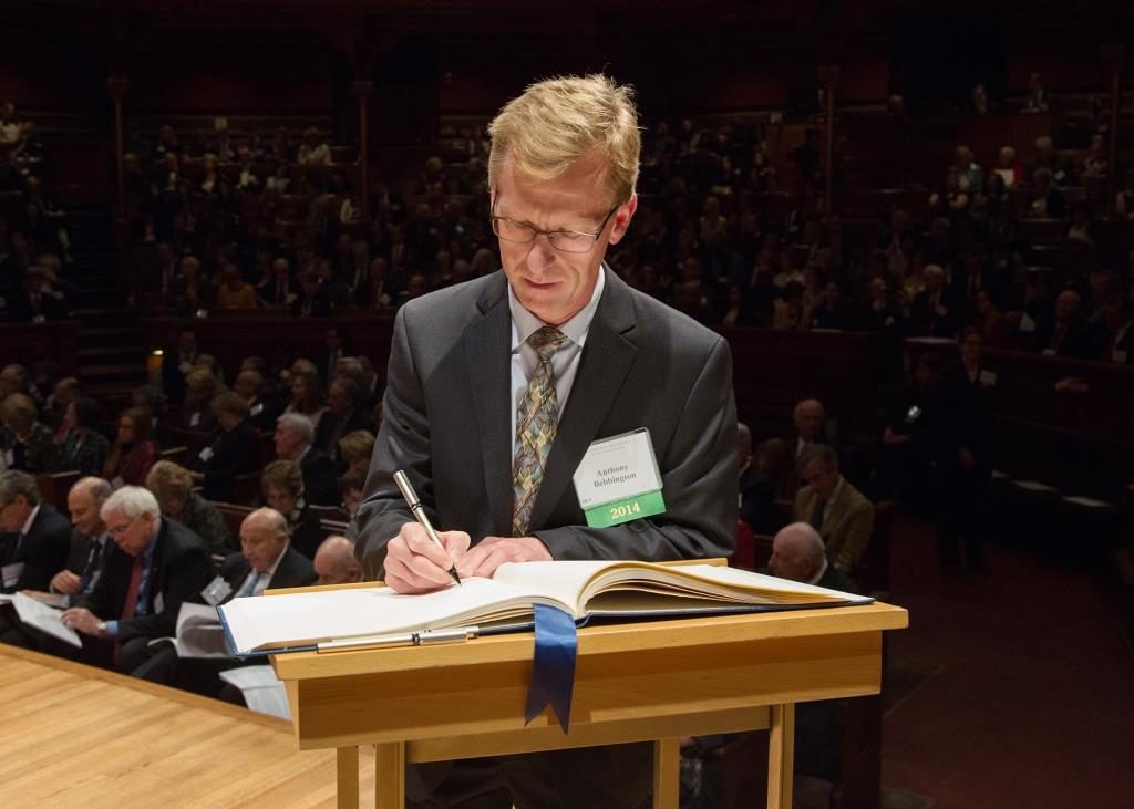 Anthony Bebbington, Clark University Professor of Geography and Higgins Professor of Environment and Society, signs the American Academy of Arts and Sciences’ Book of Members, a tradition that dates back to 1780.