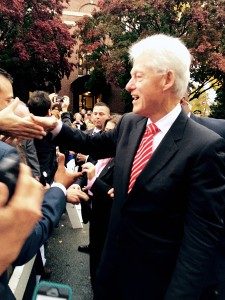 President Bill Clinton shakes hands outside Atwood Hall.
