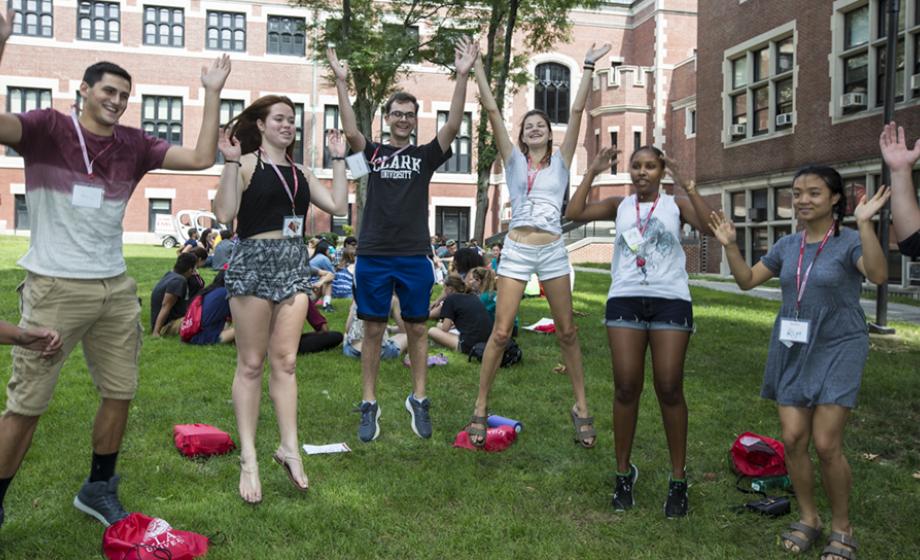 Students engaged in activity on the green