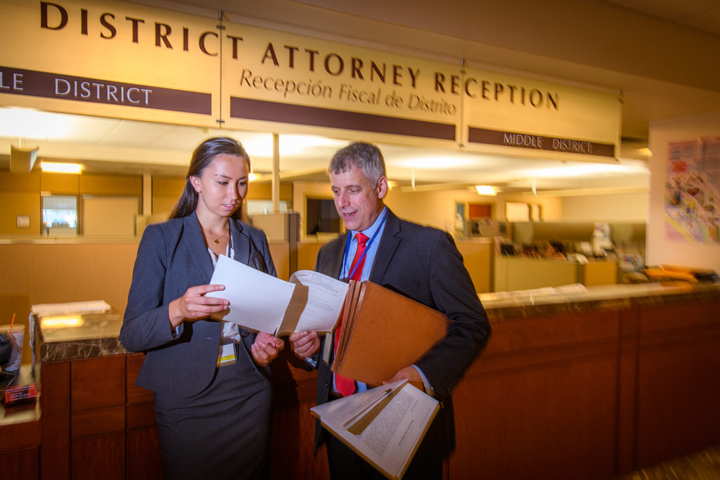 Rachael Chen talks to a prosecutor in the District Attorney's office
