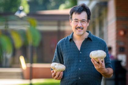 David Hibbett holding mushrooms