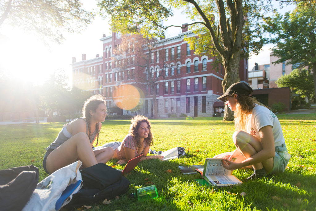 Students on the Clark University campus green