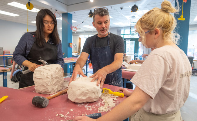 Professor and students work in new sculpture studio