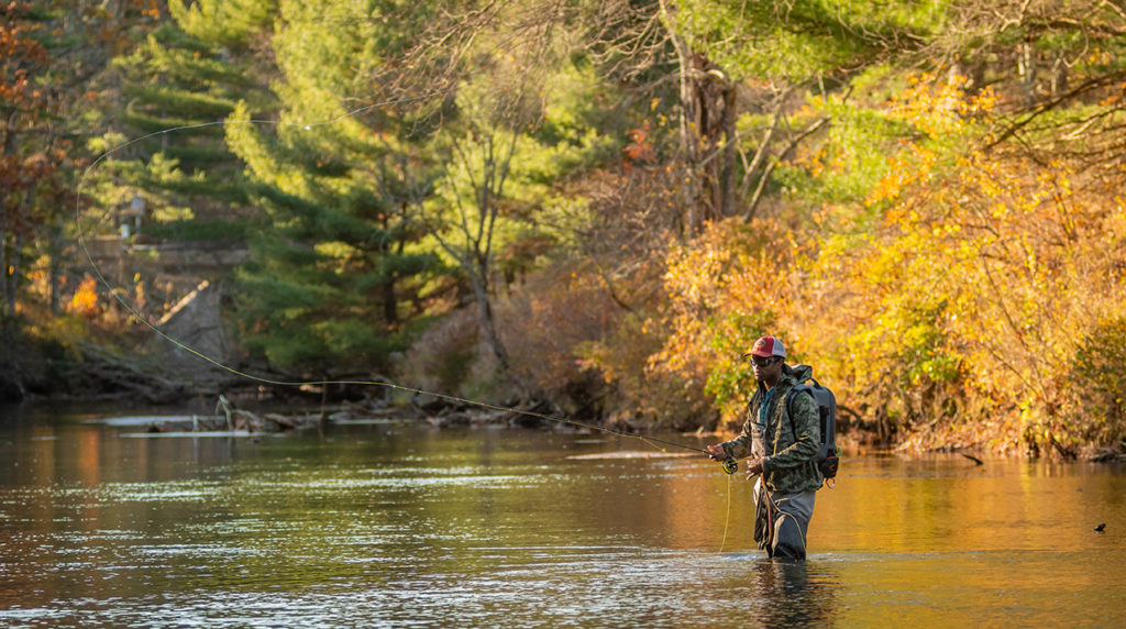 Quincy Milton III fly fishes on the Swift River in Belchertown, Mass.