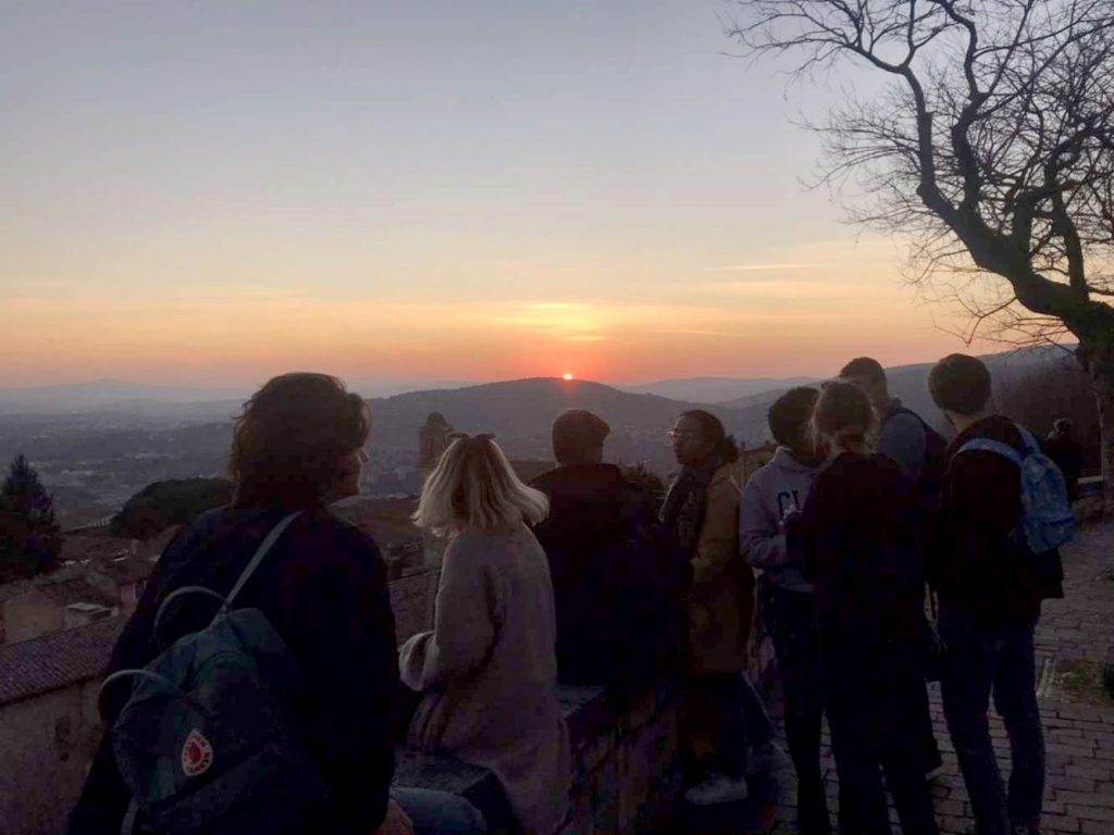 Study abroad students watch the sunset in Italy