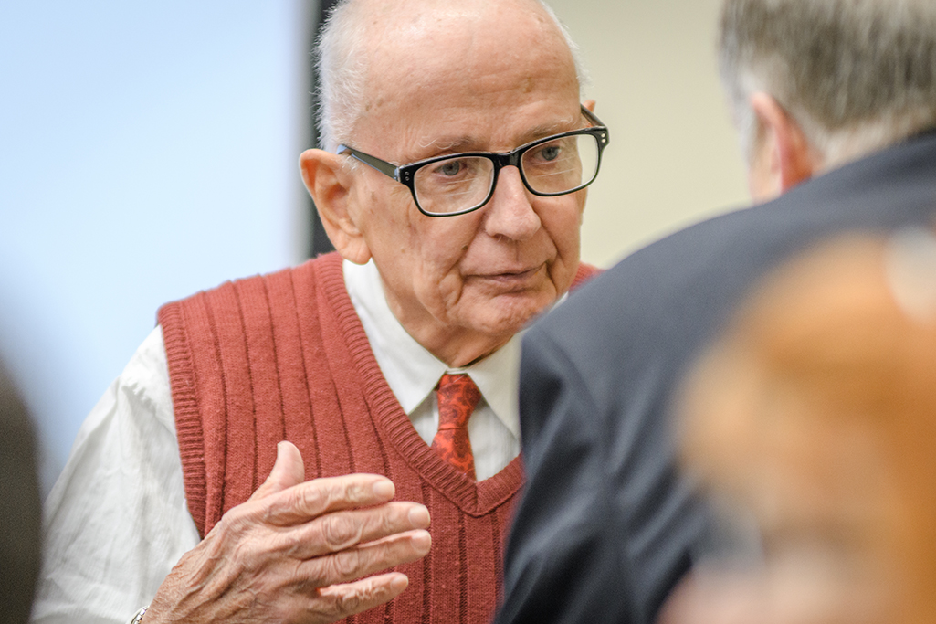 William Koelsch, M.A. ’59, speaks with an attendee of "The Revenant Returns."