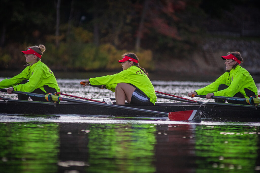 Members of the Clark women's rowing team practice during an early-morning session on Lake Quinsigamond.