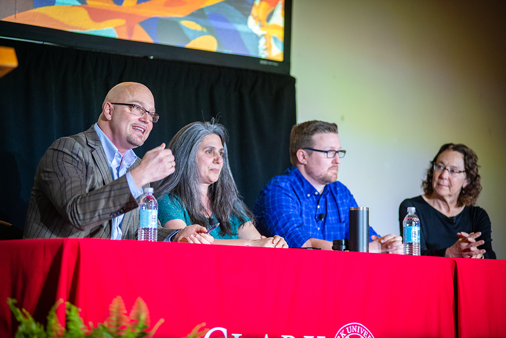 Professors Eric DeMeulenaere, Laurie Ross, Donald Spratt, and Shelly Tenenbaum discuss Clark's work in the community.