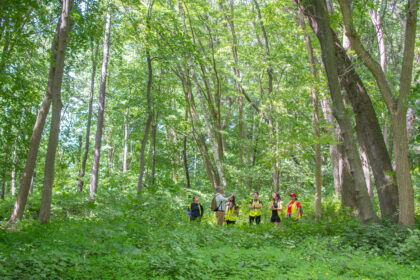 professor and students in woods