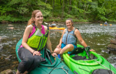 Katie Liming, M.S. ’22, and Stephanie Covino, M.S./ES&P ’15, on the Blackstone River.
