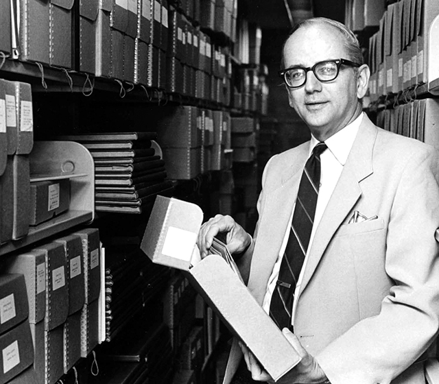 Bill Koelsch in the stacks of Goddard Library.