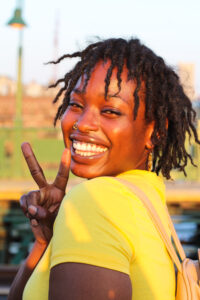 woman making peace sign