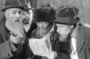 Screenshot of City Without Jews film, with old men reading newspaper