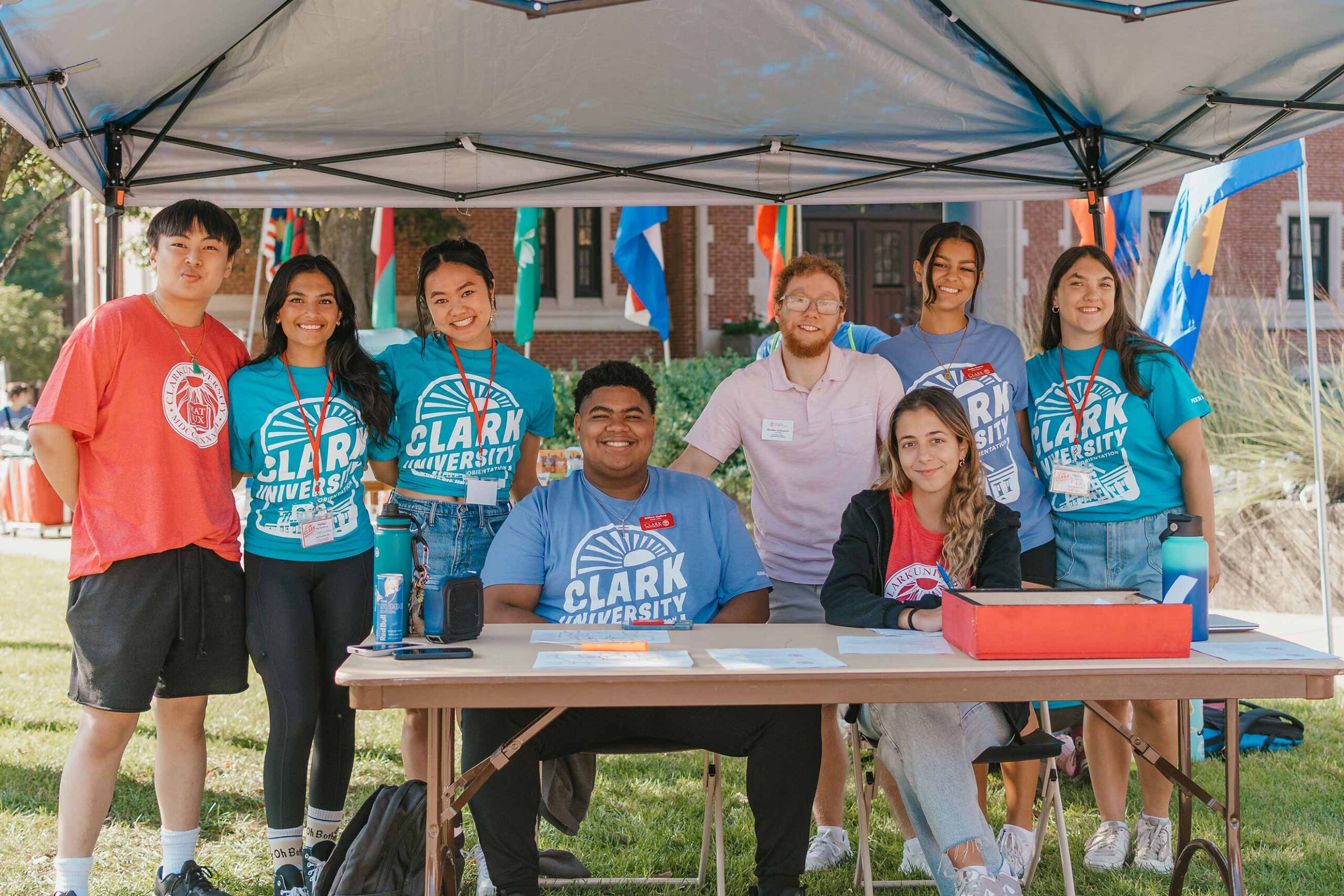 A group of peer mentors at a welcome table