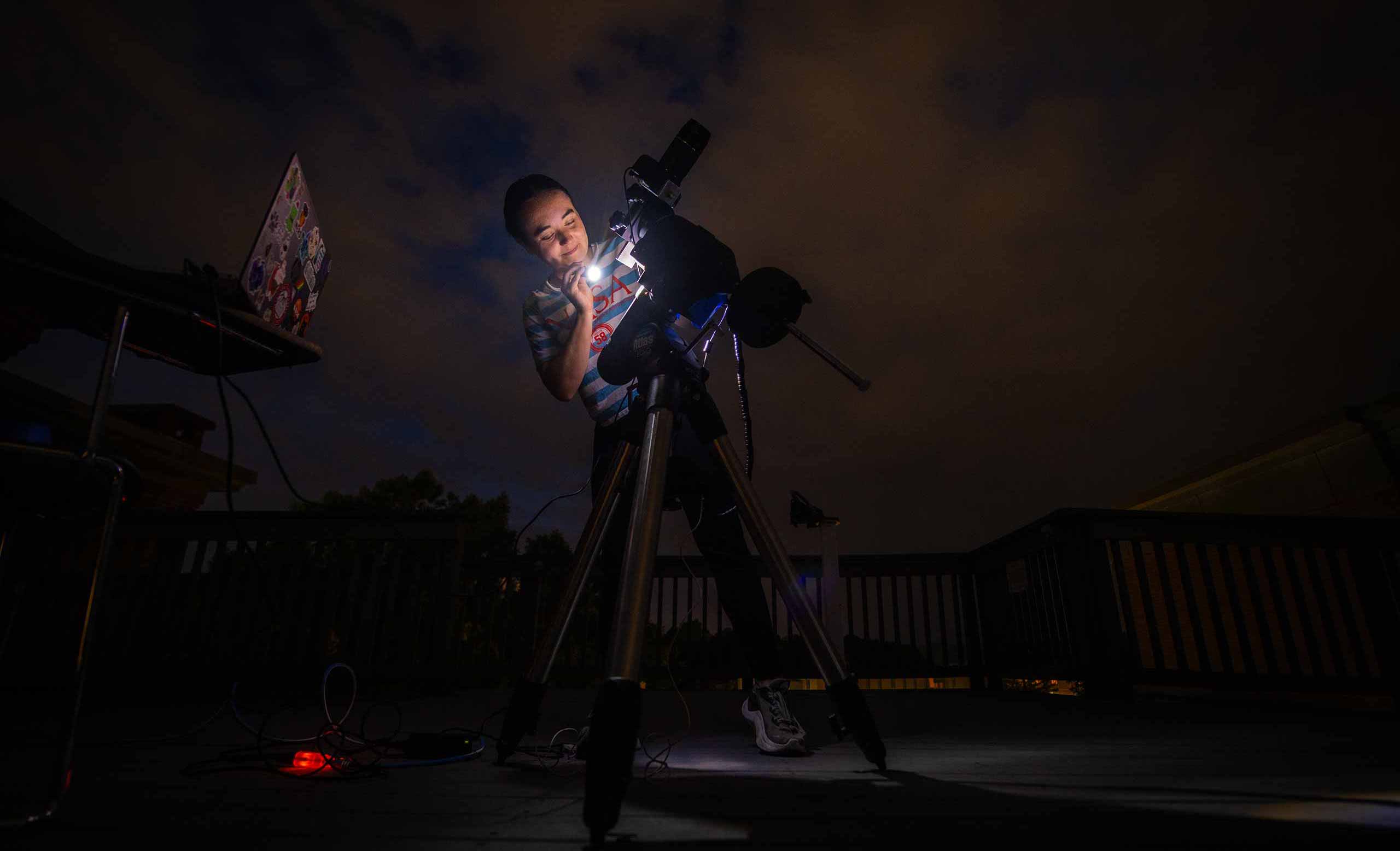 Rosa Newshare explores astrophotography at night on top of the math and physics building.