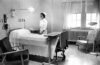 Nurse in 1940s hospital room