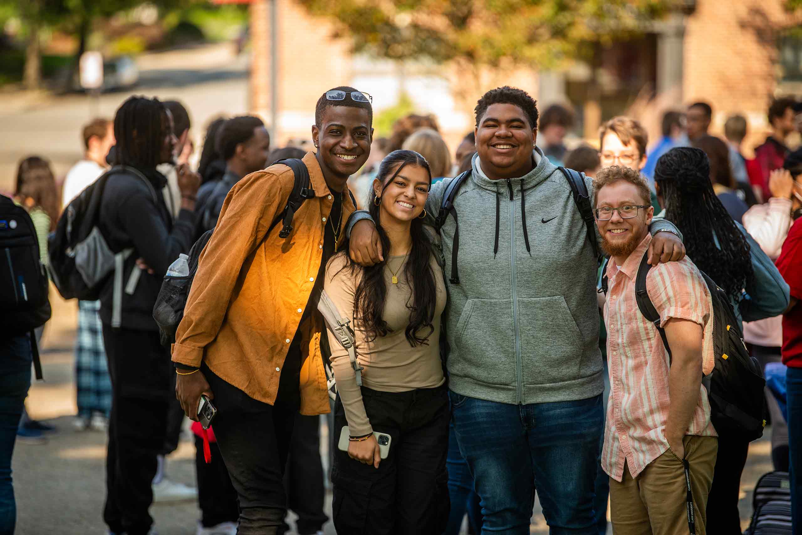 A group of smiling student poses for a picture during #FreshCheckDay, Clark University