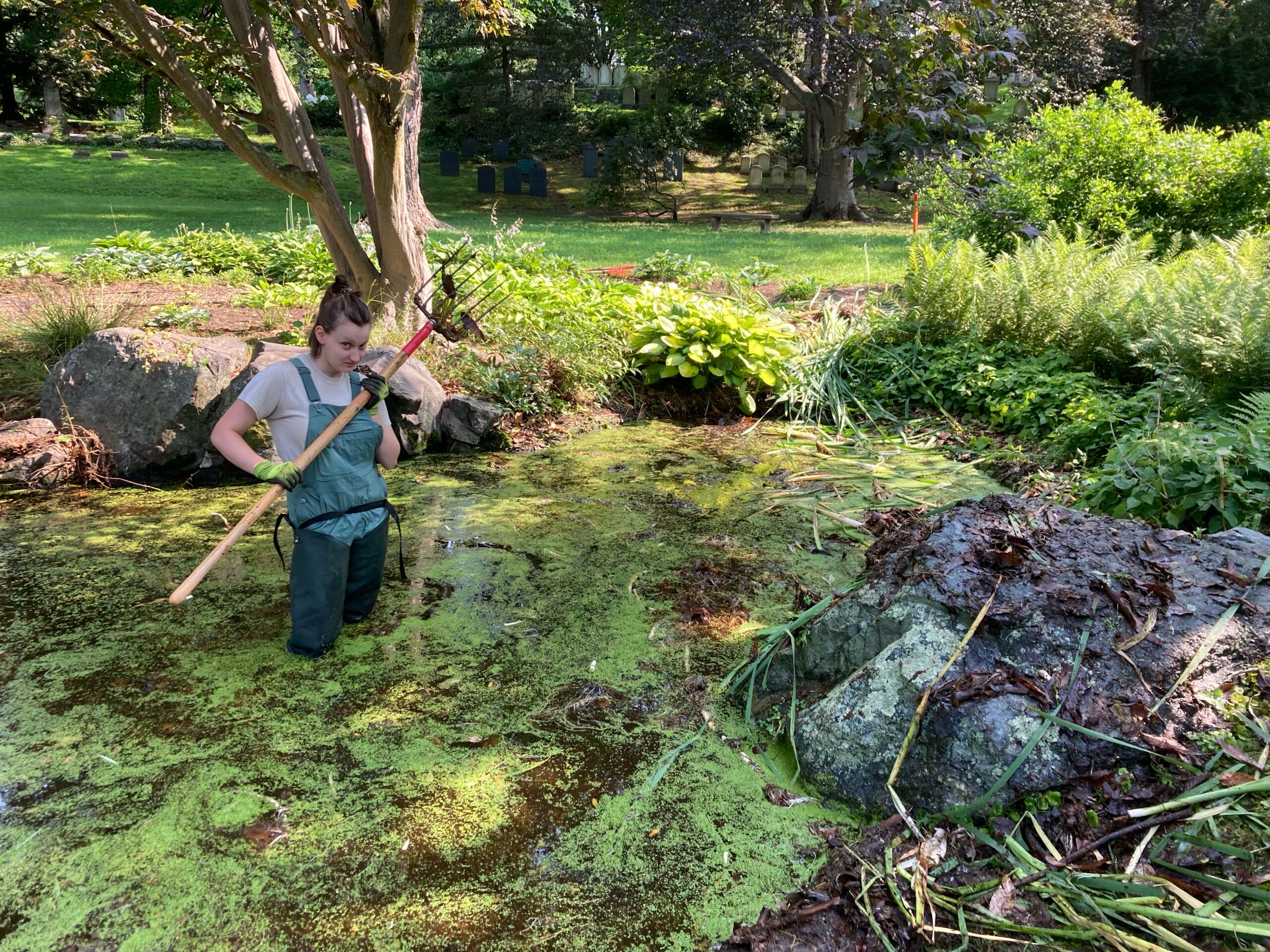student standing in swamp