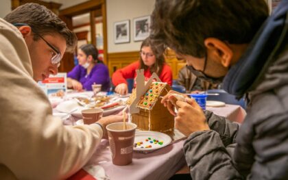 students making gingerbread house