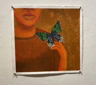 orange painting with green butterfly