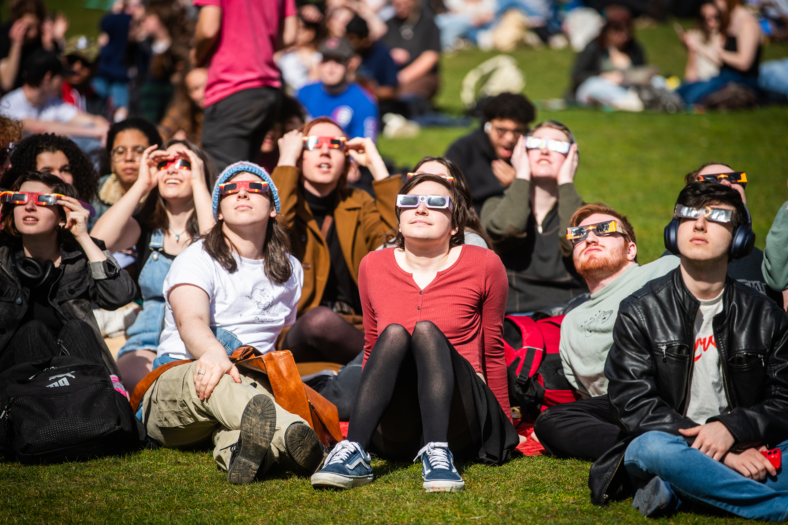 Students watch the partial solar eclipse
