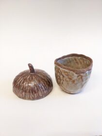 ceramic jar in shape of acorn