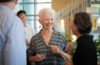 Mary-Ellen Boyle, center, shares a laugh with fellow School of Management professor Jing Zhang at the May 7 reception for retiring faculty members.
