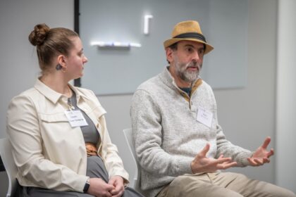 man speaks on panel