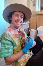 student holding a chicken